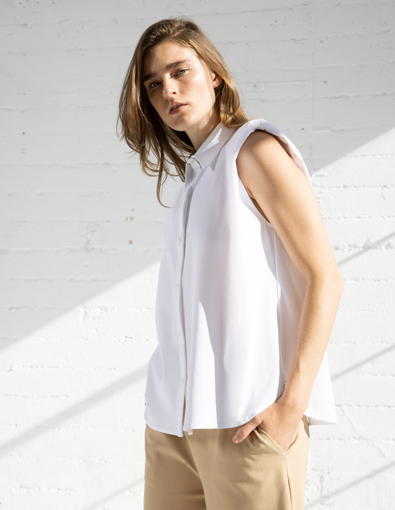 
                  
                    SLEEVELESS SHIRT IN WHITE
                  
                
